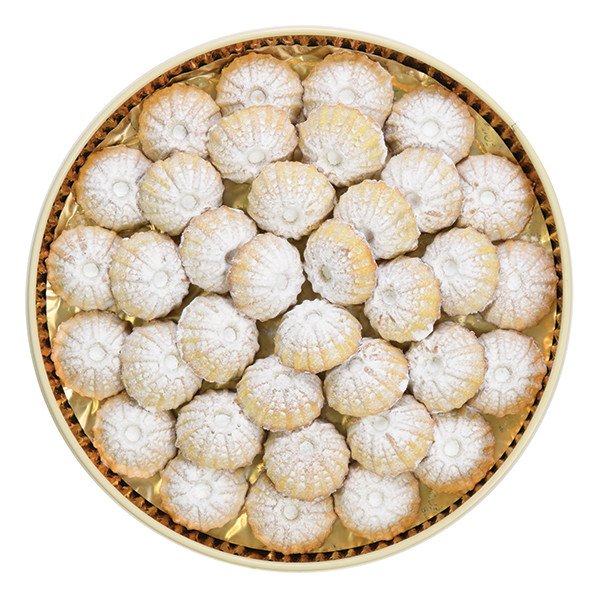 Golden-wrapped maamoul date cookies neatly arranged in a luxury gift tin by Zalatimo Brothers.