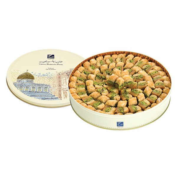 Luxury selection of pistachio-filled baklava (baklawa) in decorative round box – crafted by Zalatimo Brothers